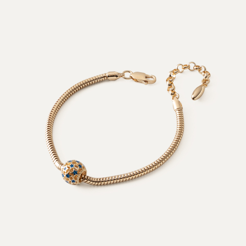 Bransoletka z ażurową kulką z niebieskimi gwiazdkami typu beads, srebro 925 w złotym pokryciu